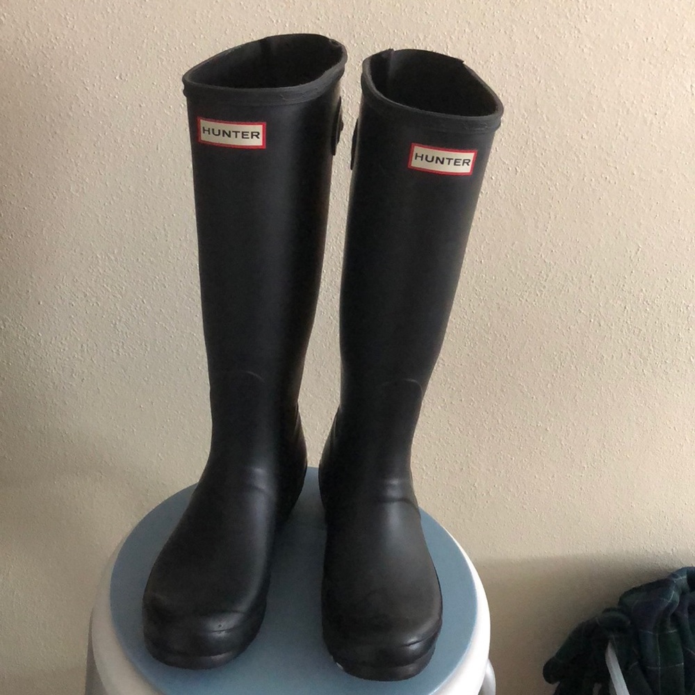 Tall black hunter boots